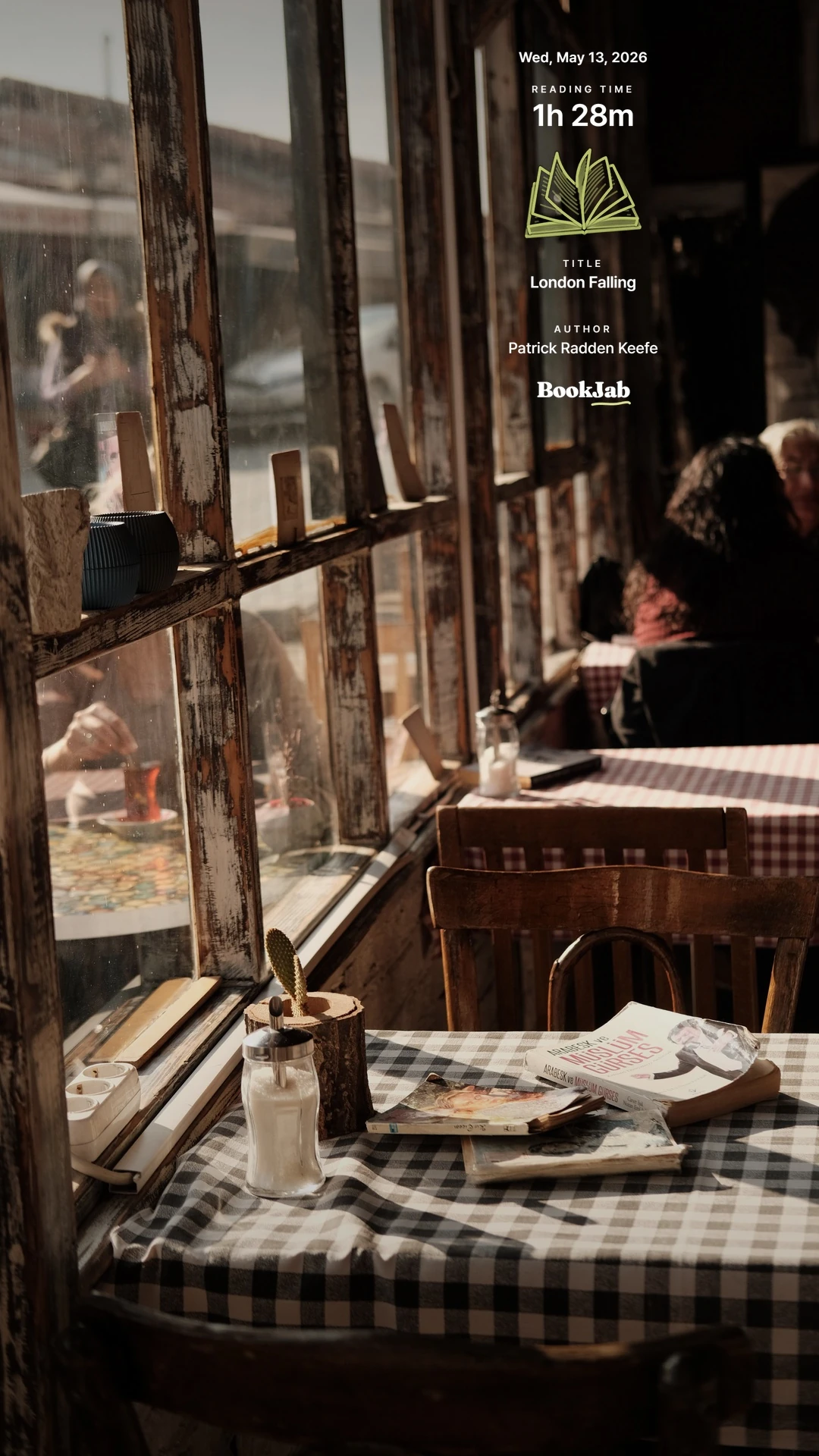 London Falling · 1h 28m — a sunlit cafe table by the window